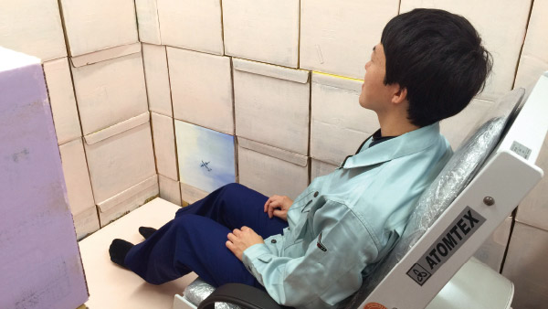 Sitting on a whole body counter to measure radiation levels in the human body ©Tarachine