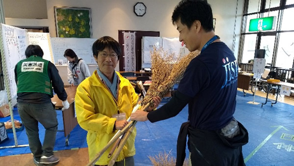 JISP staff providing cleaning  supplies at Social Welfare Council in Osato ©JISP