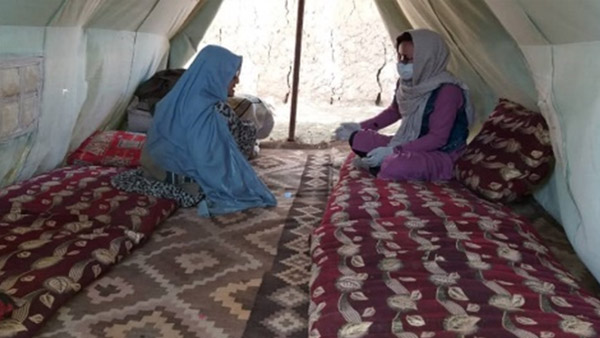 Interviewing a beneficiary about her living conditions, Afghanistan ©CWS